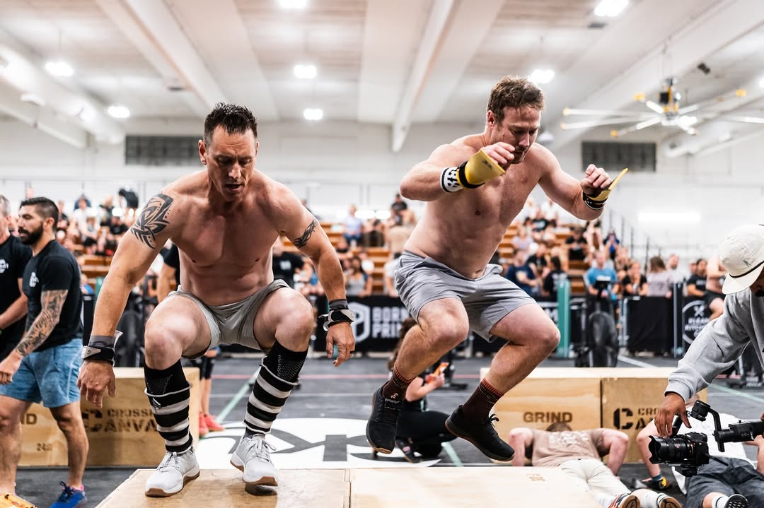Athlete performing box jumps during competition